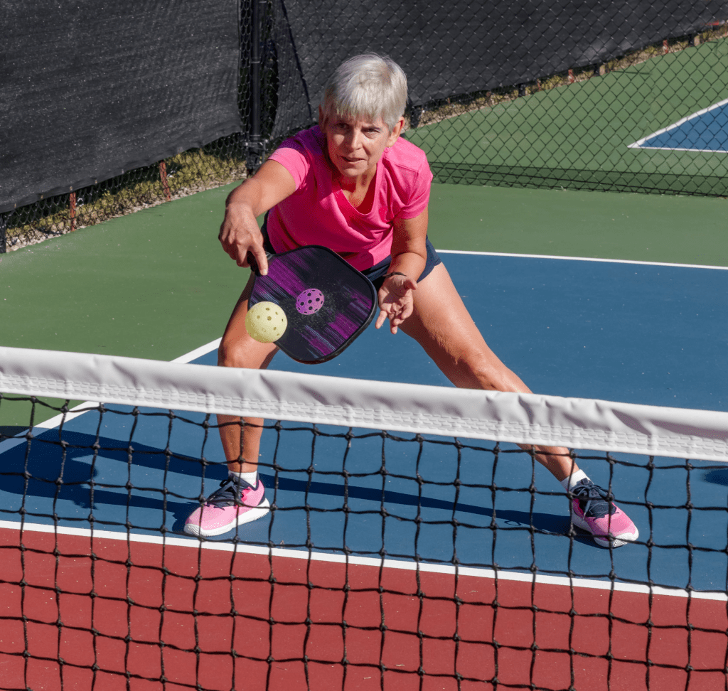 Pickleball player practicing her dinks