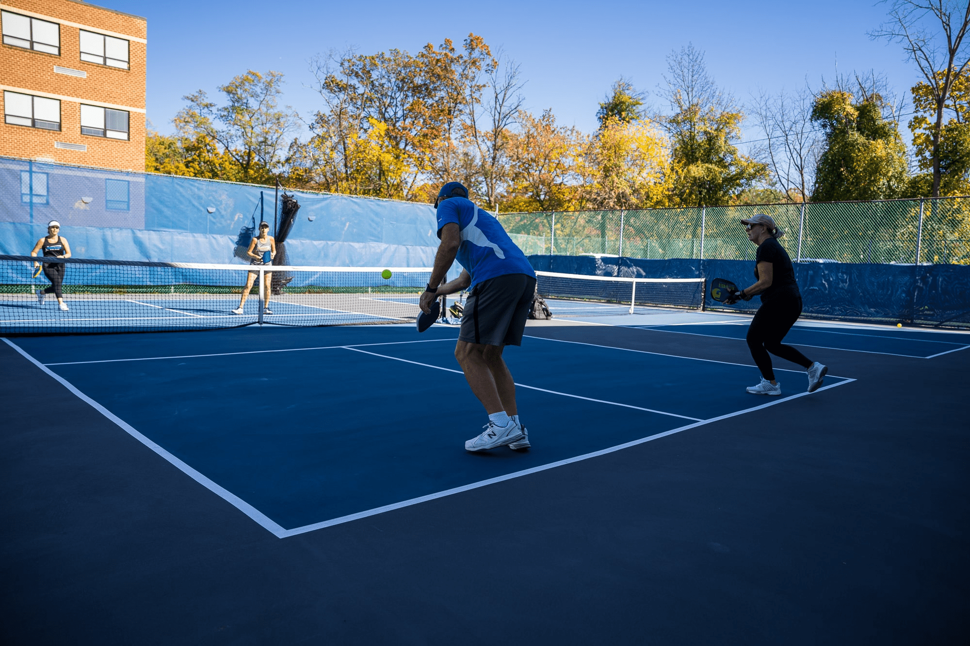What muscles does pickleball work? Players on court working out
