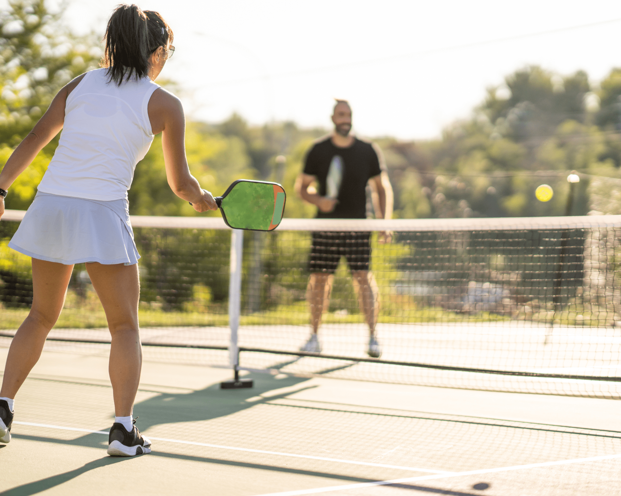 People Buring Calories Playing Pickleball
